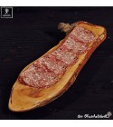 Cutting board, a bit oval, natural with parts of the bark